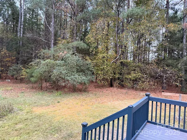 a view of a yard from a balcony