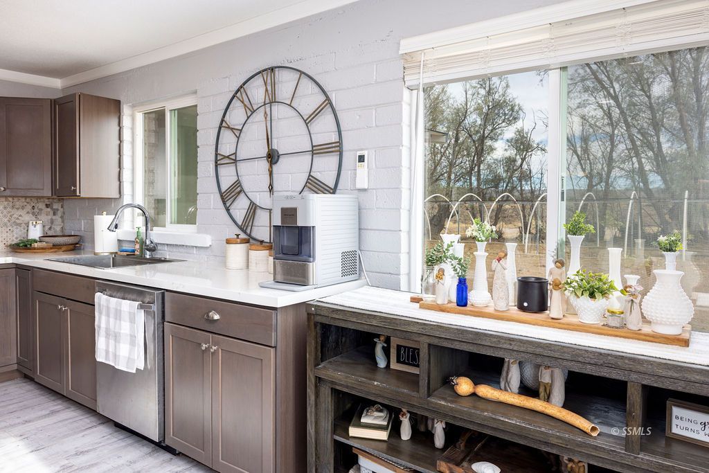 134 South Sierra View Street Ridgecrest, CA 93555 - Photo 13 of 43 a kitchen with a sink and a large window