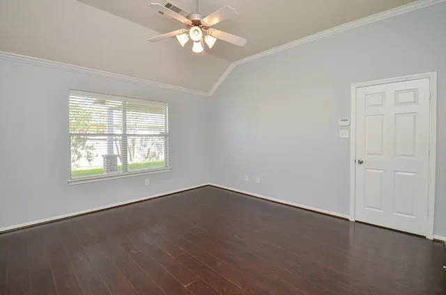 a view of a livingroom with a chandelier furniture and windows