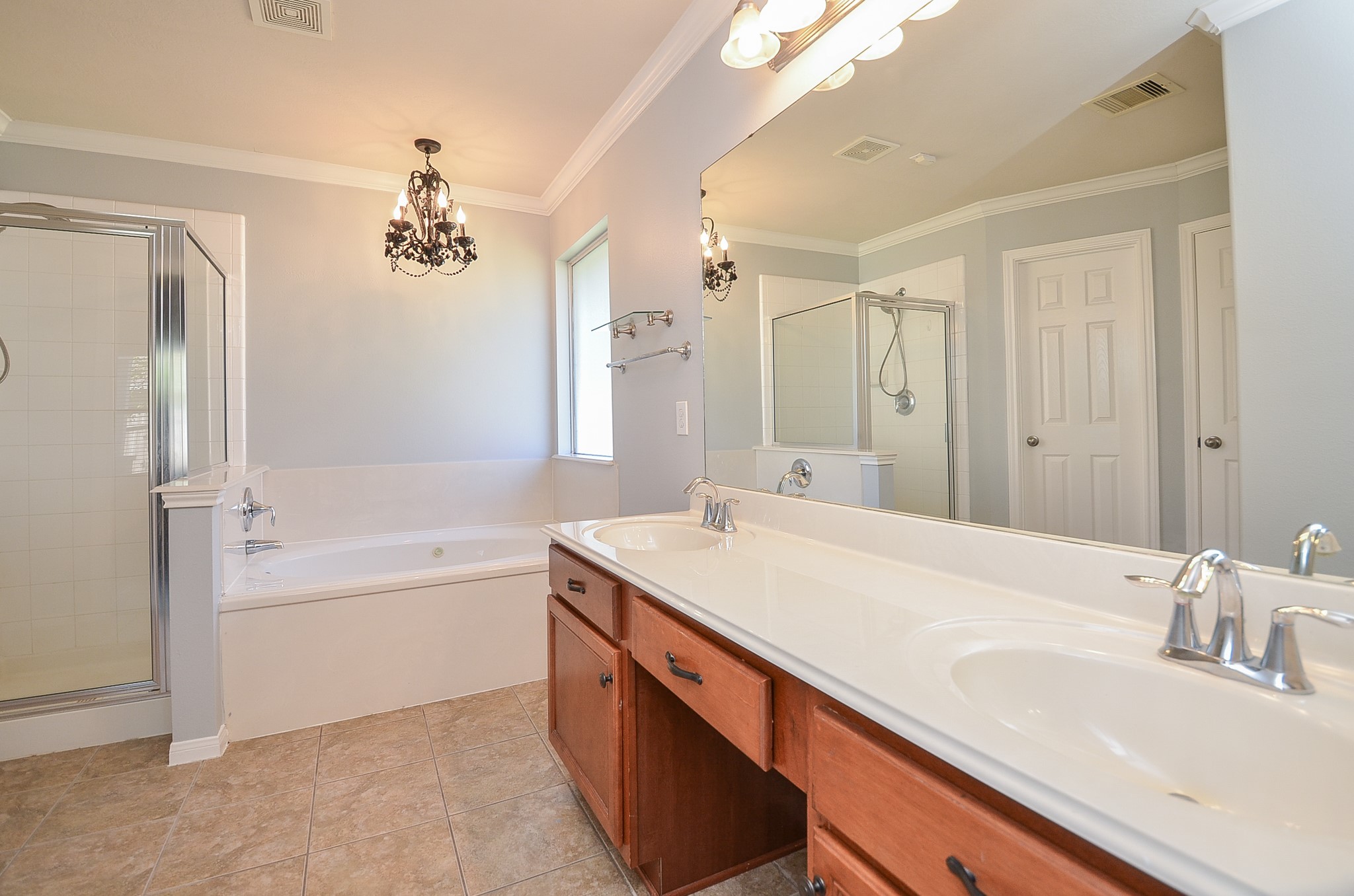 25226 Diamond Ranch Drive Katy, TX 77494 - Photo 17 of 28 a bathroom with a tub sink and mirror