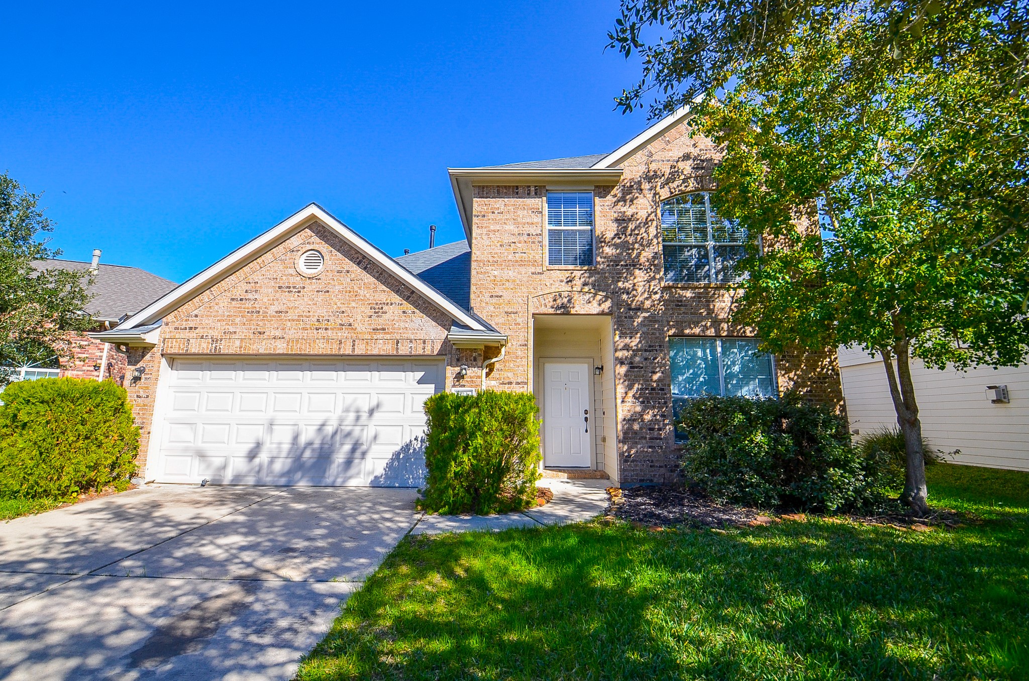 25226 Diamond Ranch Drive Katy, TX 77494 - Photo 4 of 28 a front view of a house with a yard and garage