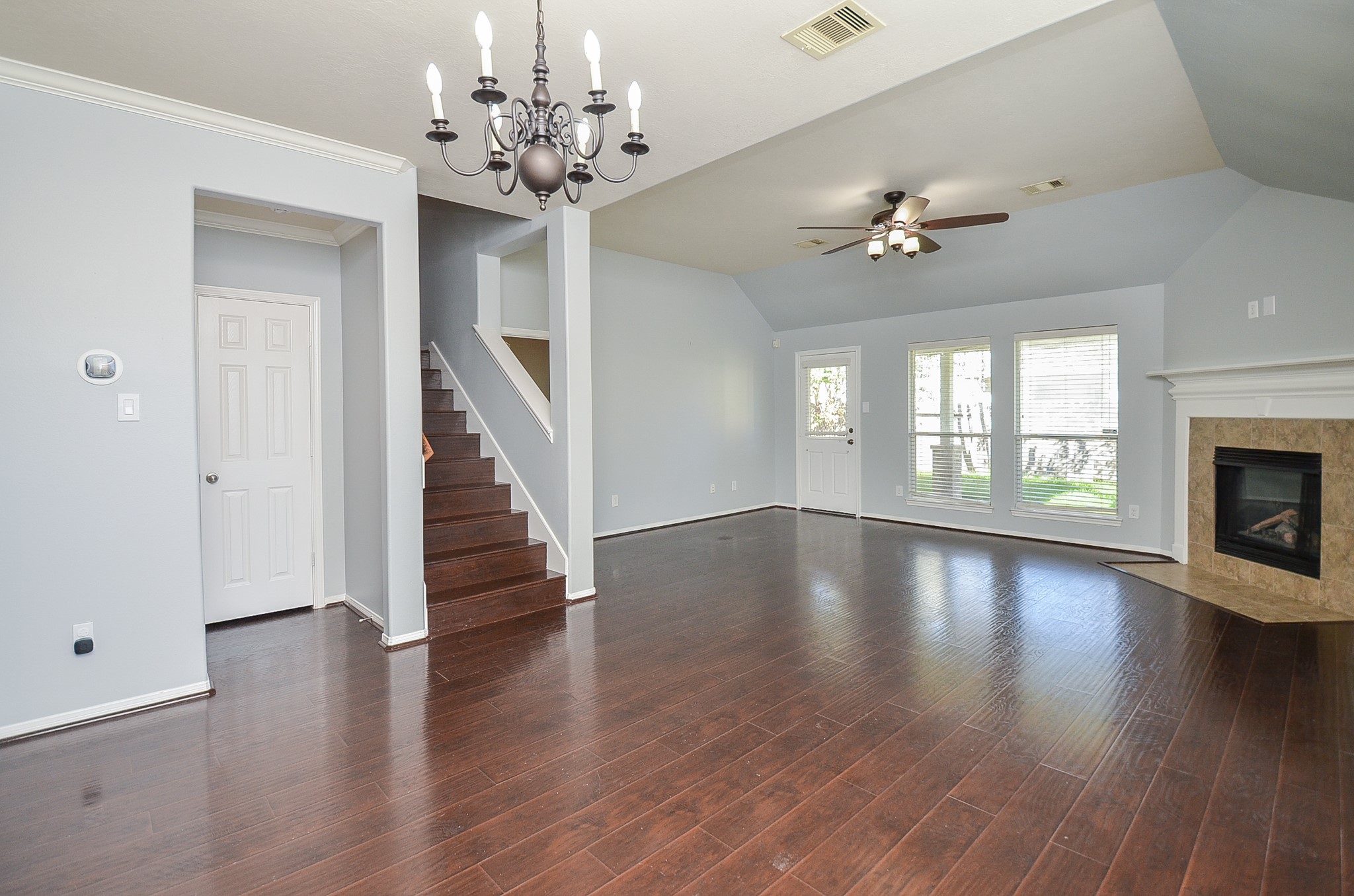 25226 Diamond Ranch Drive Katy, TX 77494 - Photo 7 of 28 a view of an empty room with wooden floor and a window