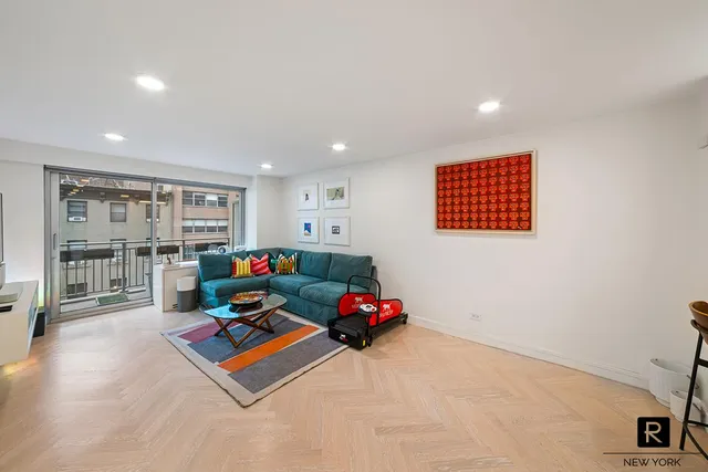 a living room with furniture and a table