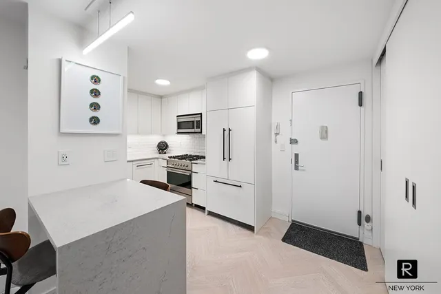 a living room with furniture pool and a table