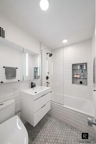 a kitchen with sink cabinets and stainless steel appliances