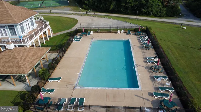 a view of a lake with houses in back