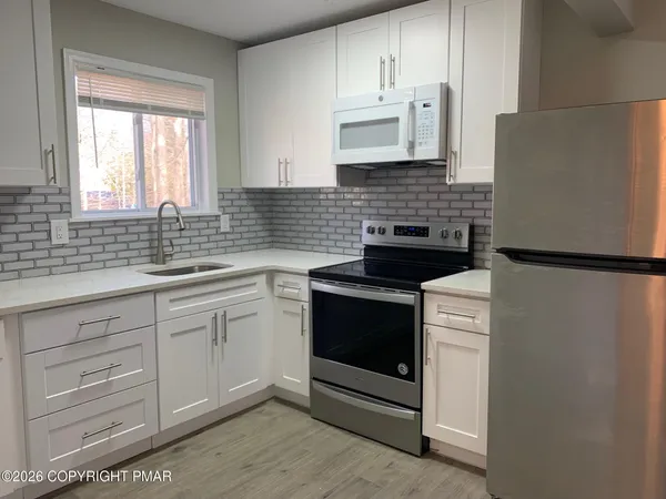 a view of storage and utility room with washer and dryer