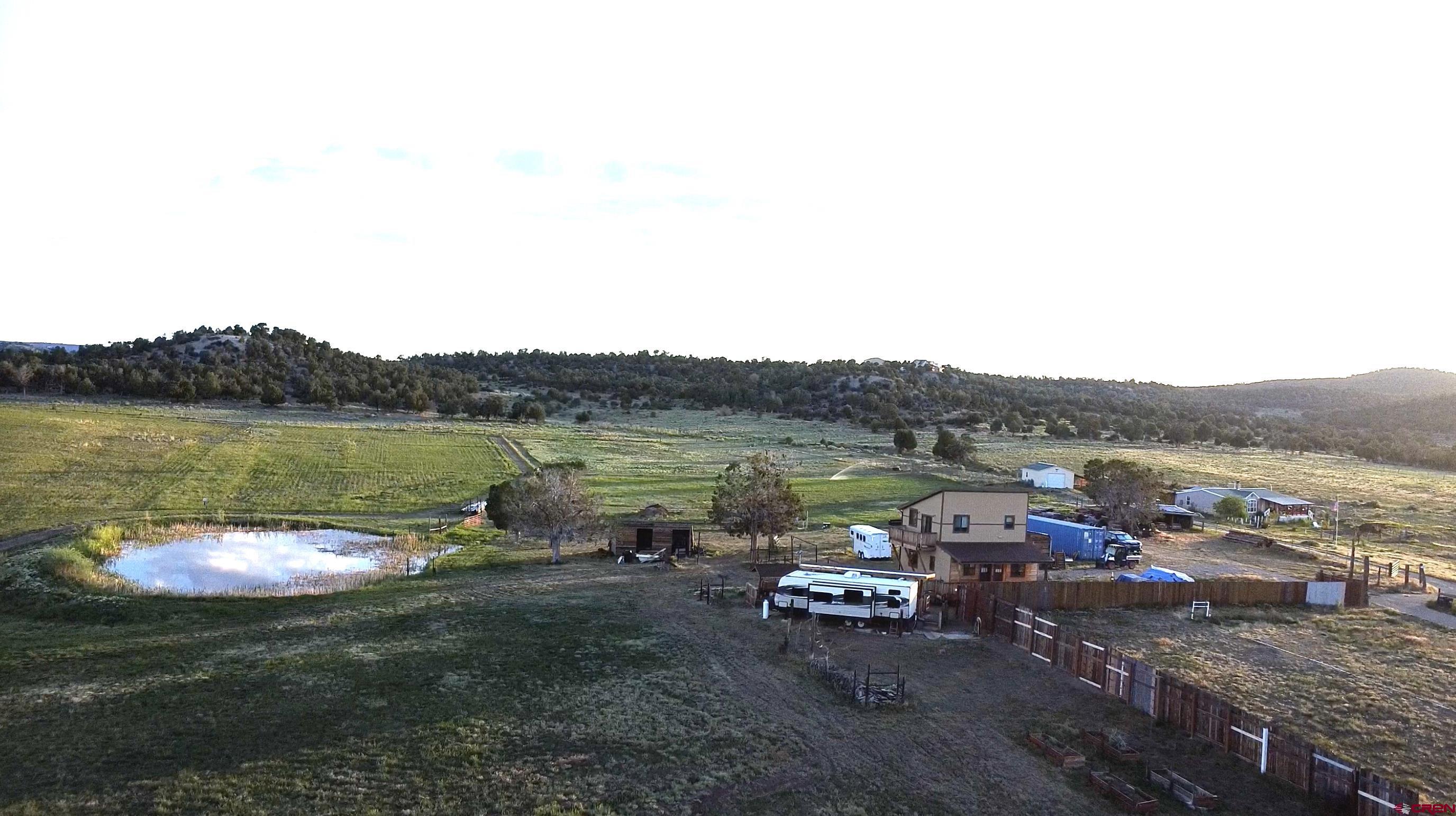 34099 Rd M Mancos, CO 81328 - Photo 2 of 37 a view of a lake with outdoor space