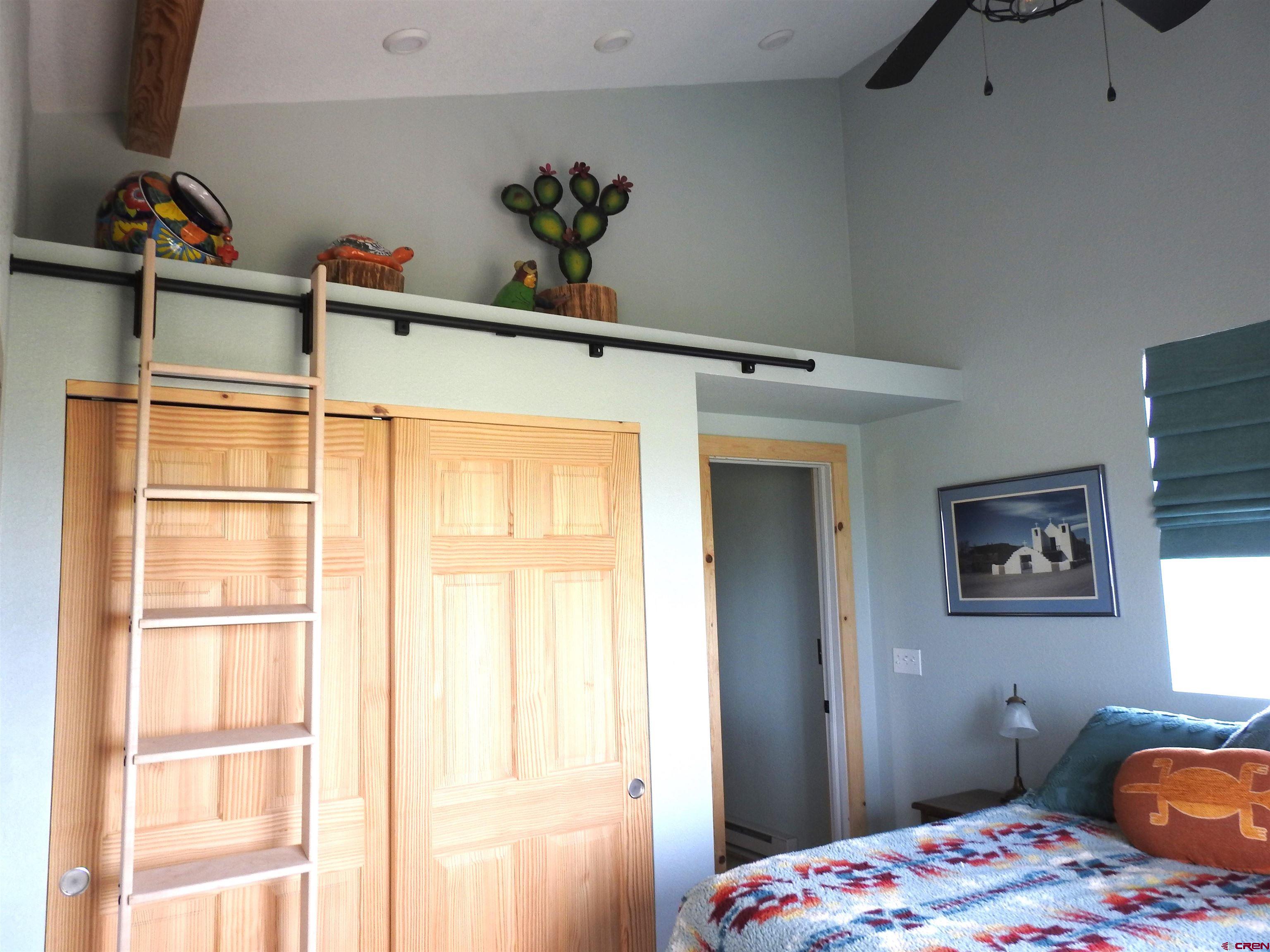 34099 Rd M Mancos, CO 81328 - Photo 22 of 37 a bedroom with a bed and a window