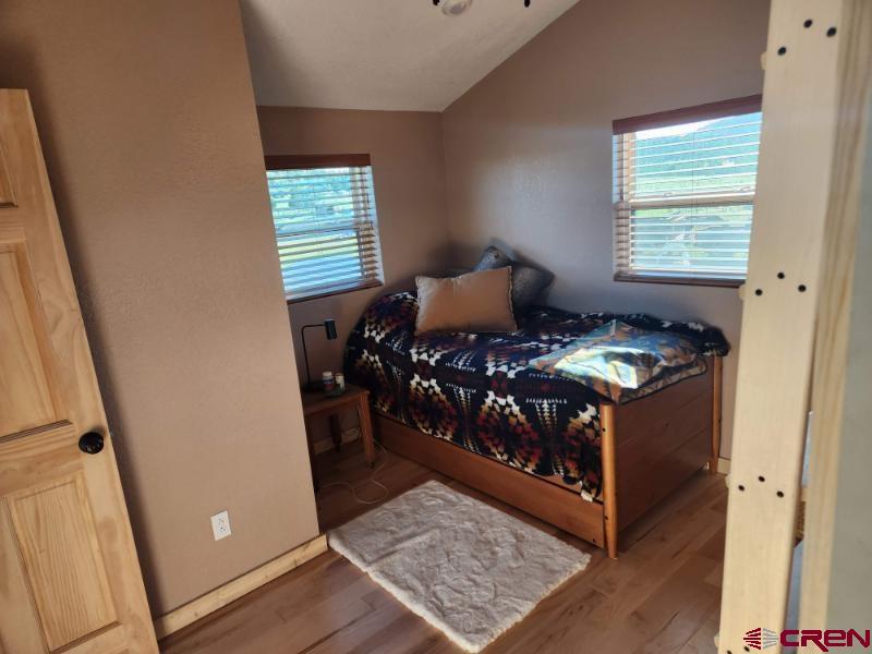 34099 Rd M Mancos, CO 81328 - Photo 23 of 37 a bed room with a bed and a window
