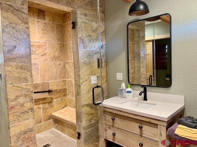 34099 Rd M Mancos, CO 81328 - Photo 24 of 37 a bathroom with a sink and a mirror