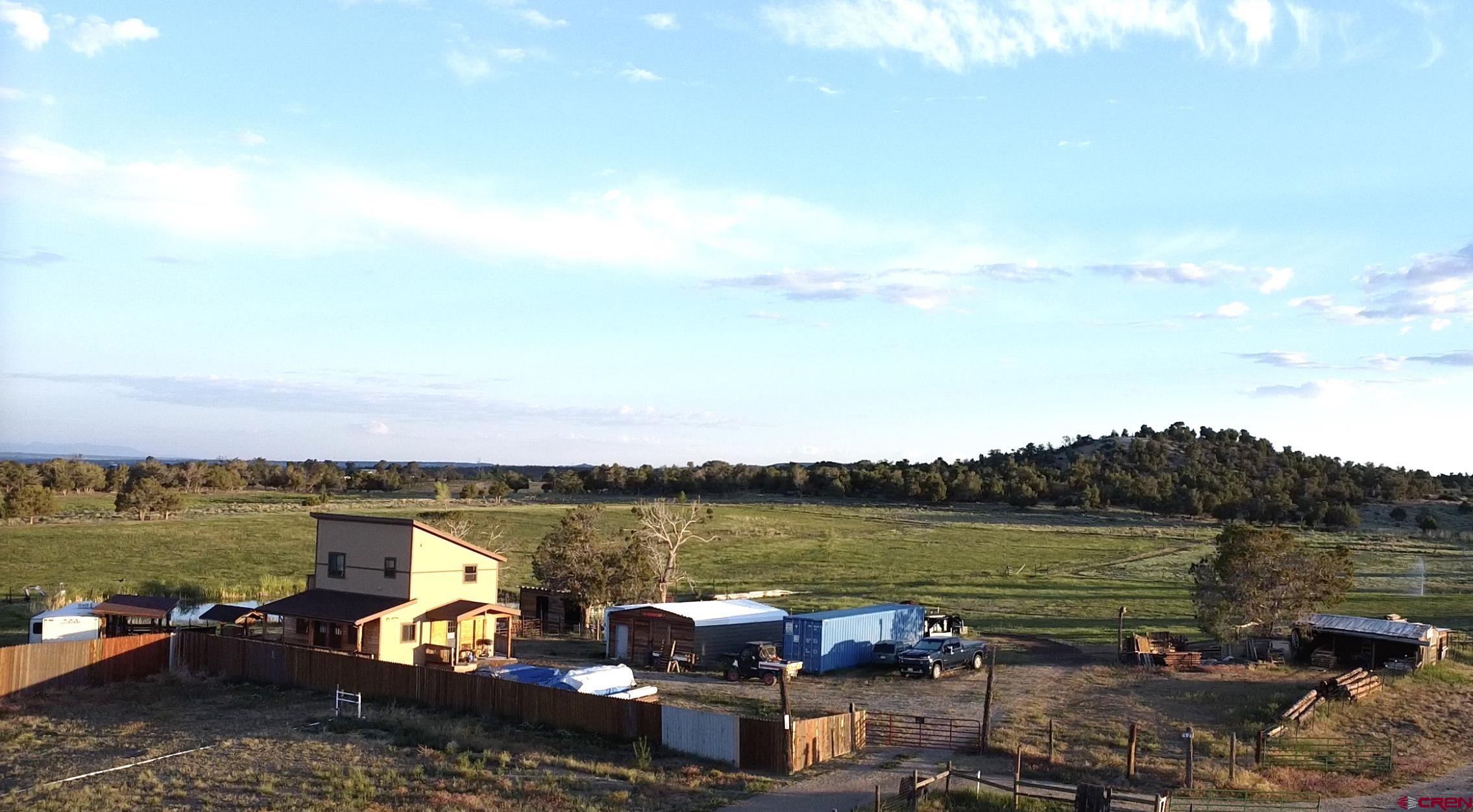 34099 Rd M Mancos, CO 81328 - Photo 30 of 37 a view of a lake with couches chairs