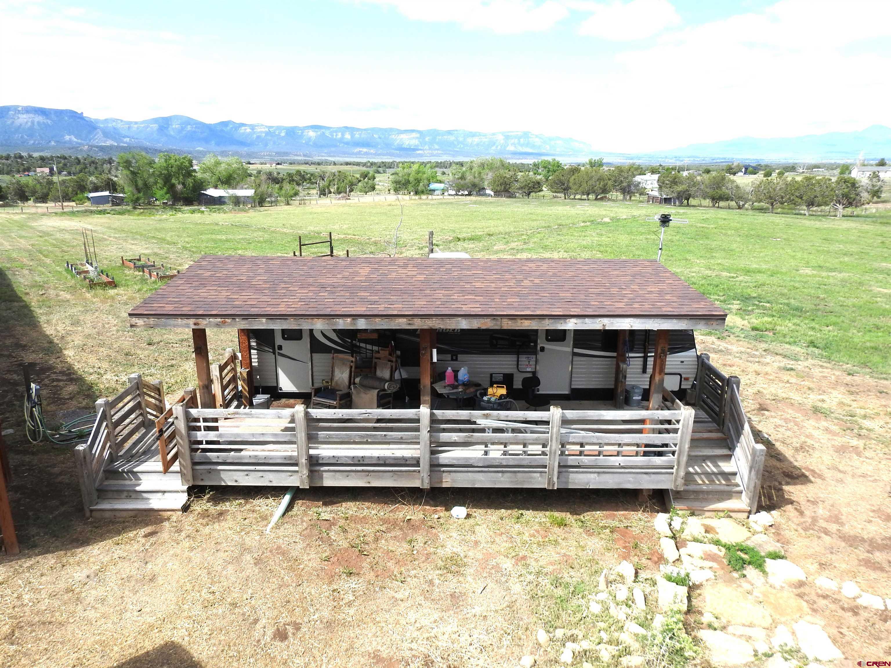 34099 Rd M Mancos, CO 81328 - Photo 32 of 37 a view of a house with pool and a yard