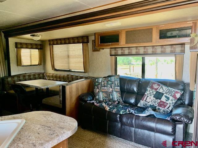 34099 Rd M Mancos, CO 81328 - Photo 36 of 37 a living room with furniture and a table