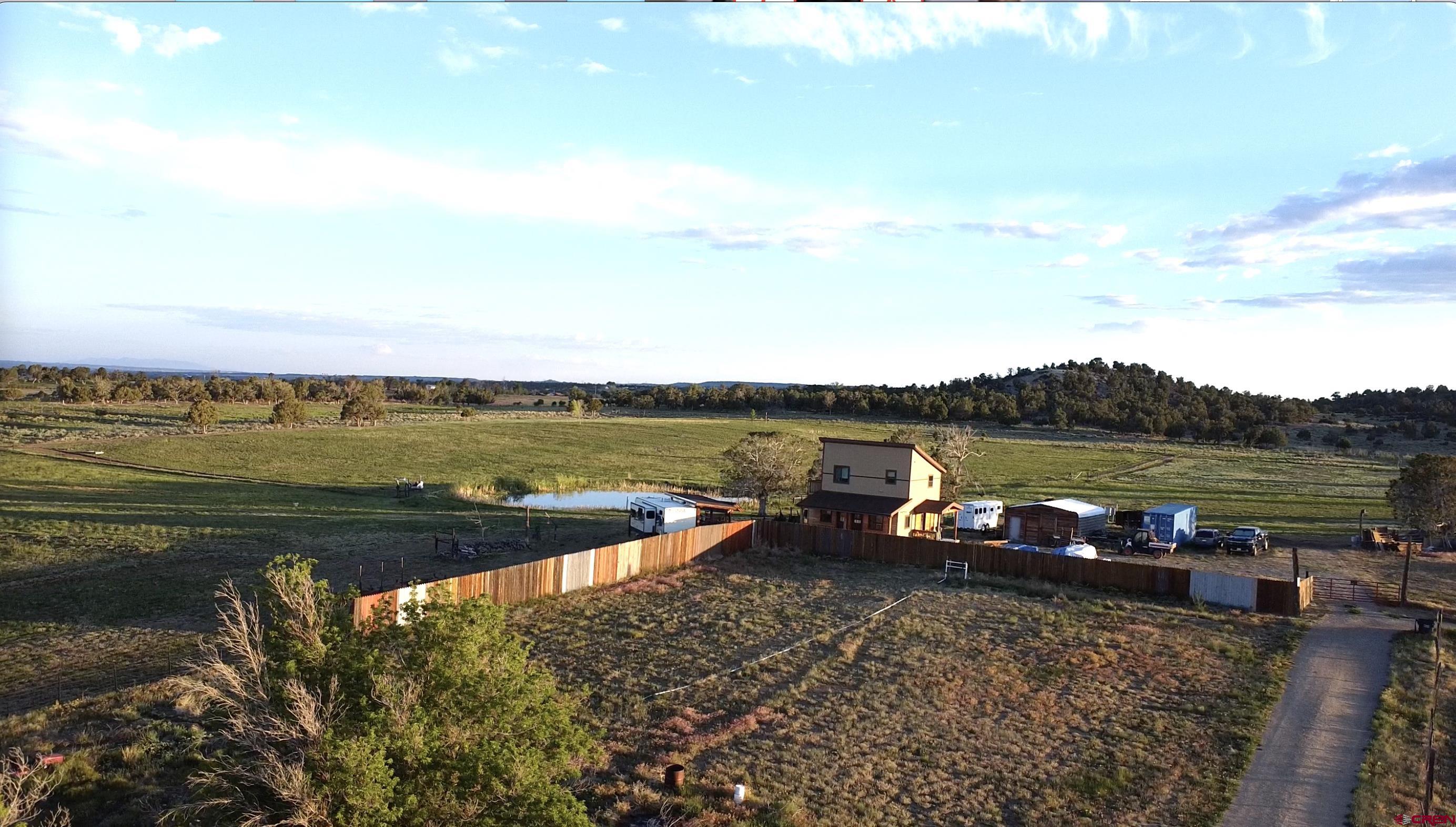34099 Rd M Mancos, CO 81328 - Photo 4 of 37 a view of a lake with houses in the back