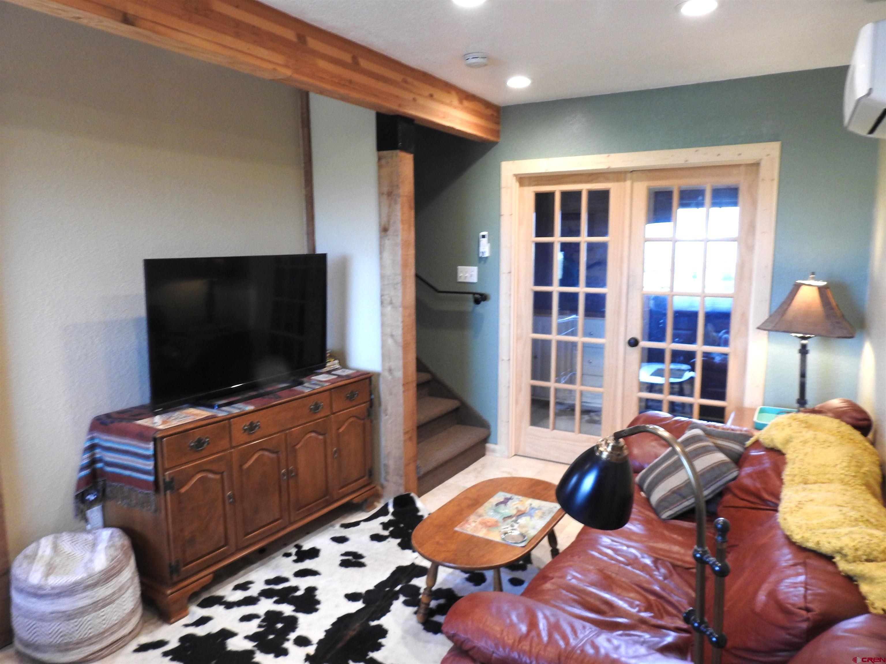 34099 Rd M Mancos, CO 81328 - Photo 8 of 37 a living room with furniture and a flat screen tv