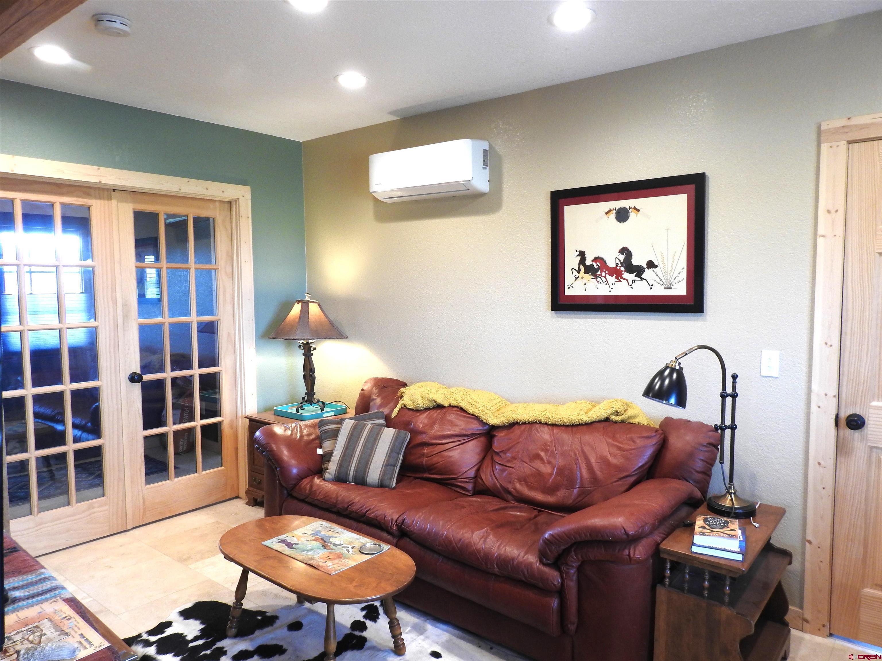 34099 Rd M Mancos, CO 81328 - Photo 9 of 37 a living room with furniture a rug and a potted plant