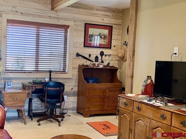 34099 Rd M Mancos, CO 81328 - Photo 10 of 37 a view of a workspace with furniture and a window