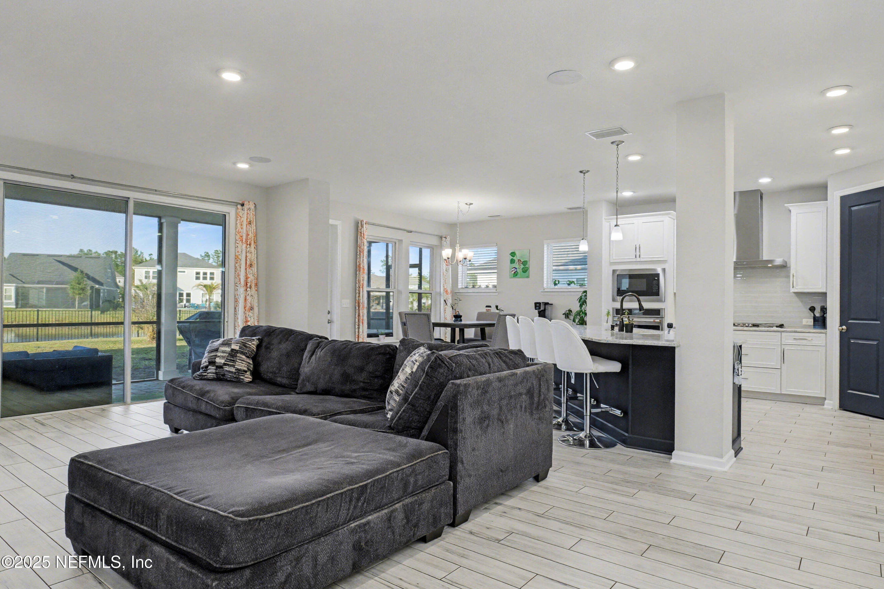 139 Spinner Drive Ponte Vedra, FL 32081 - Photo 13 of 67 a living room with furniture and a large window