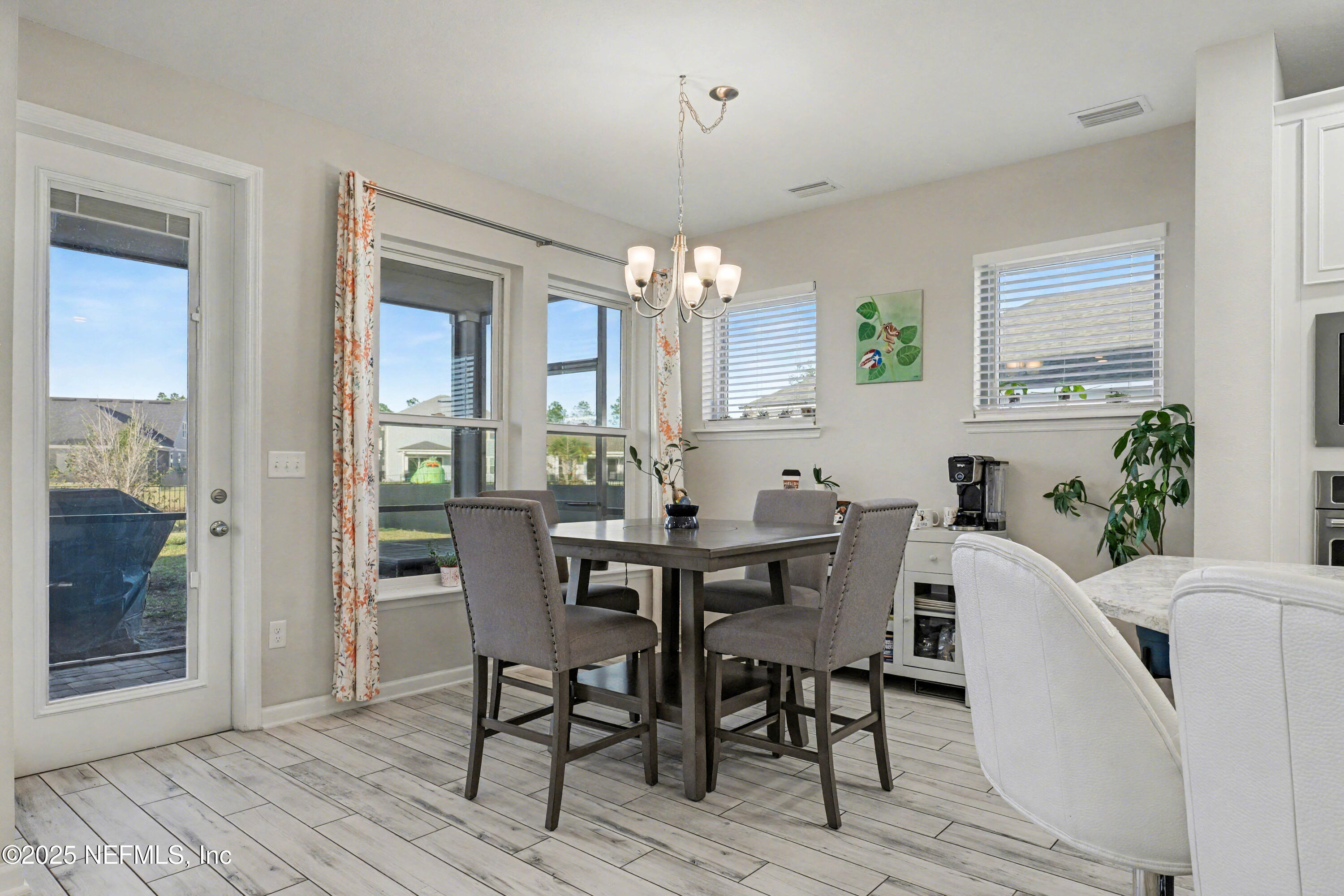 139 Spinner Drive Ponte Vedra, FL 32081 - Photo 15 of 67 a view of a dining room with furniture and window