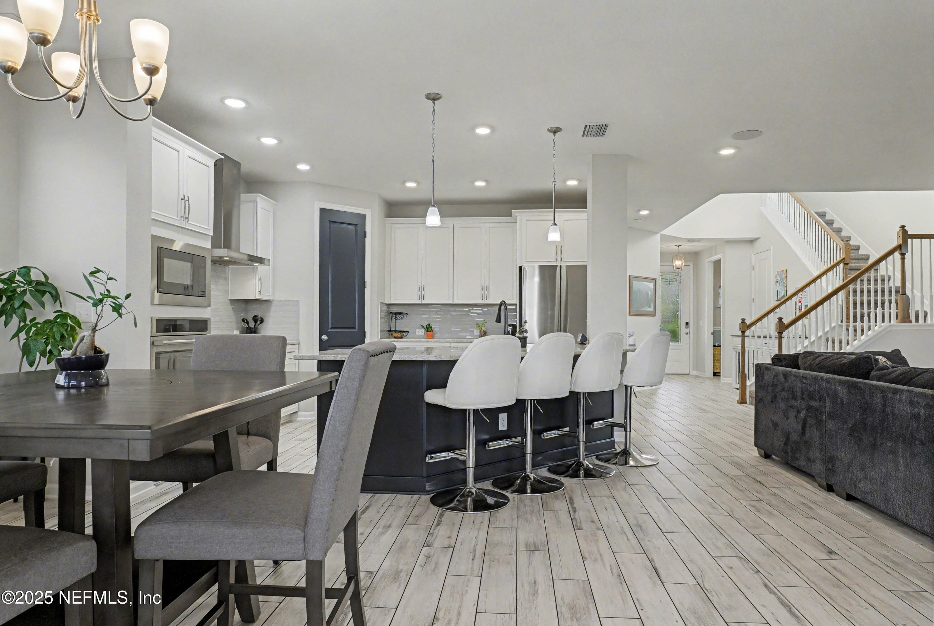 139 Spinner Drive Ponte Vedra, FL 32081 - Photo 16 of 67 a dining room with furniture and wooden floor