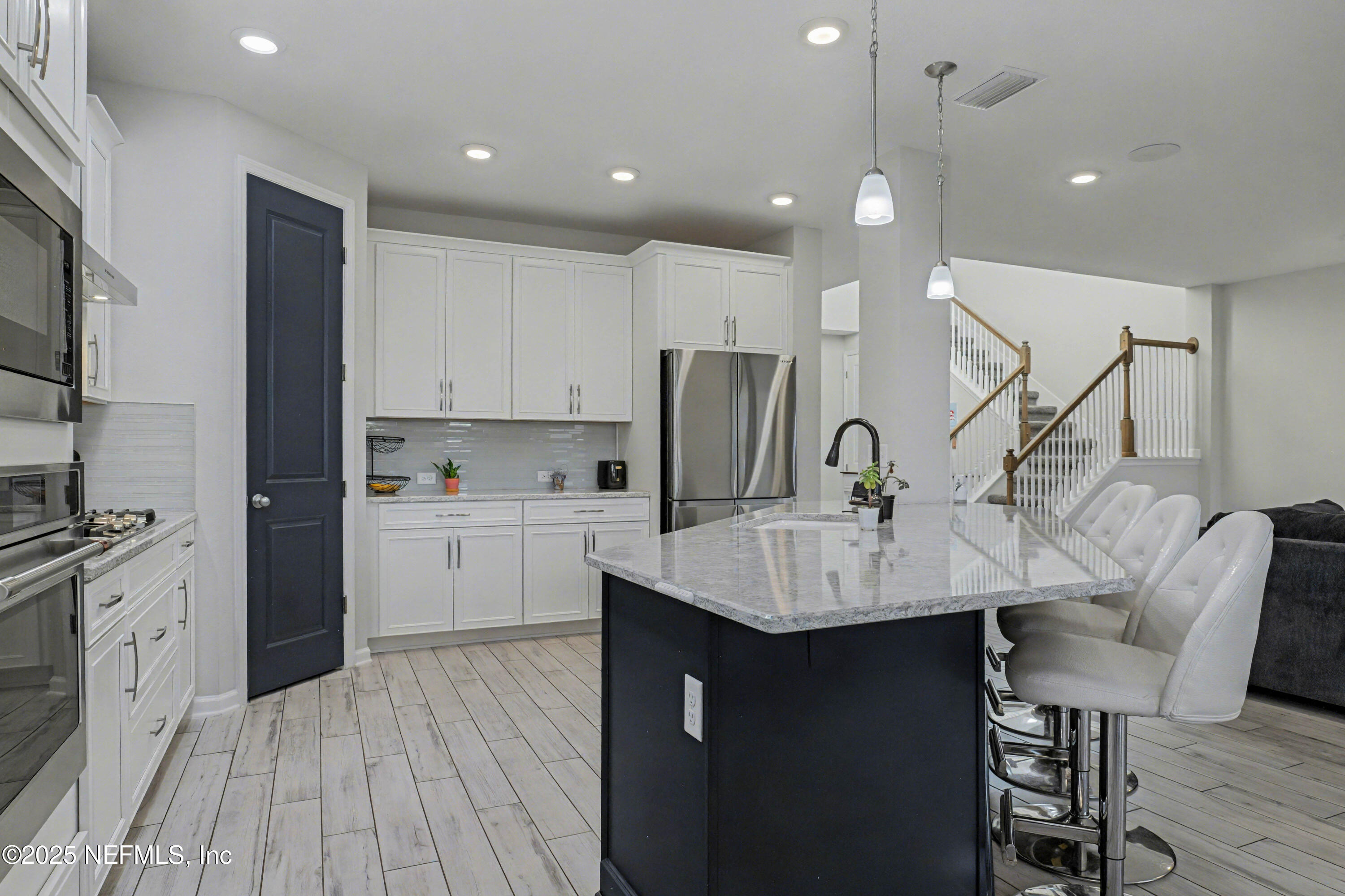 139 Spinner Drive Ponte Vedra, FL 32081 - Photo 17 of 67 a kitchen with a sink microwave and cabinets