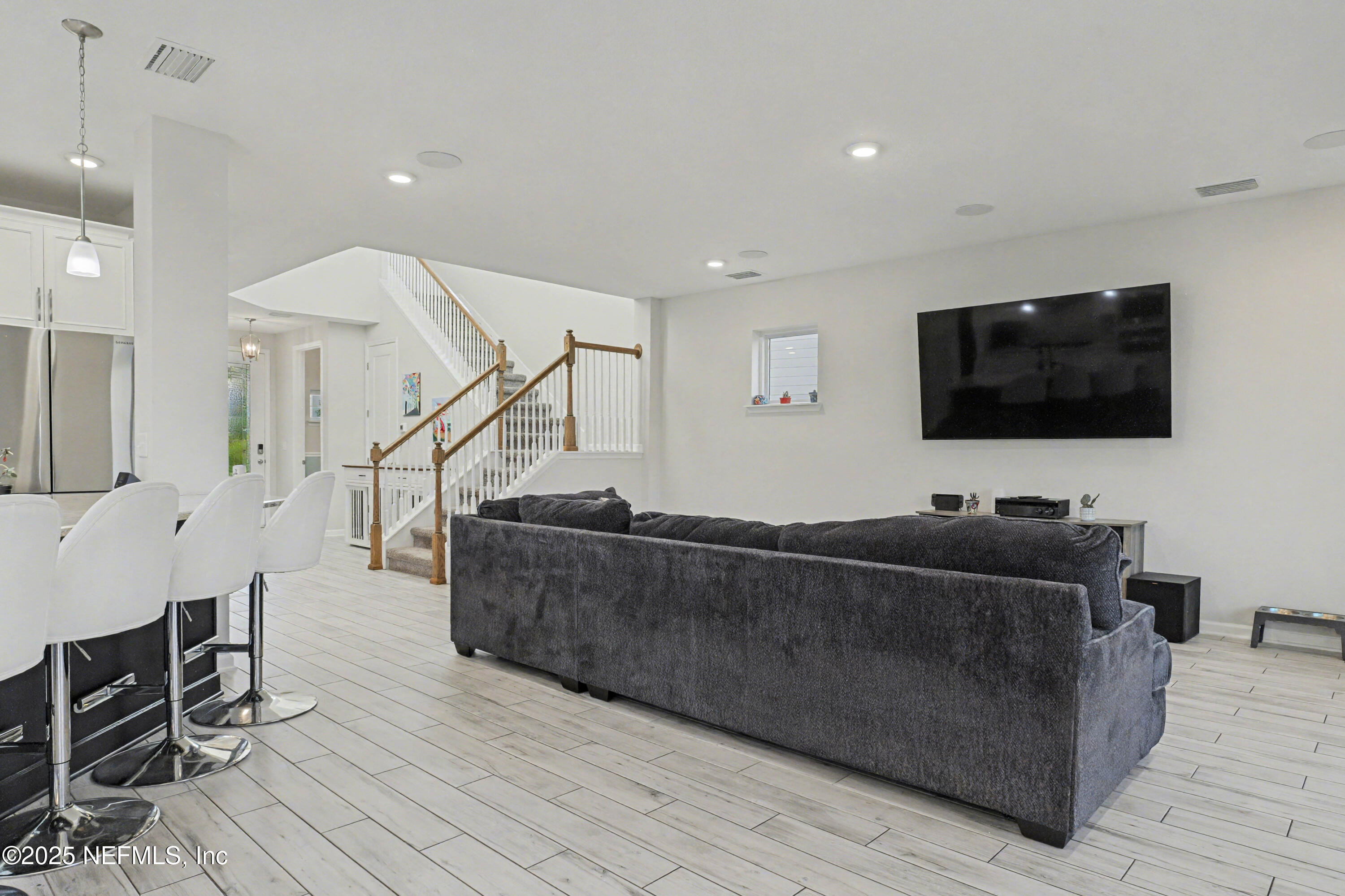 139 Spinner Drive Ponte Vedra, FL 32081 - Photo 20 of 67 a living room with furniture and a flat screen tv
