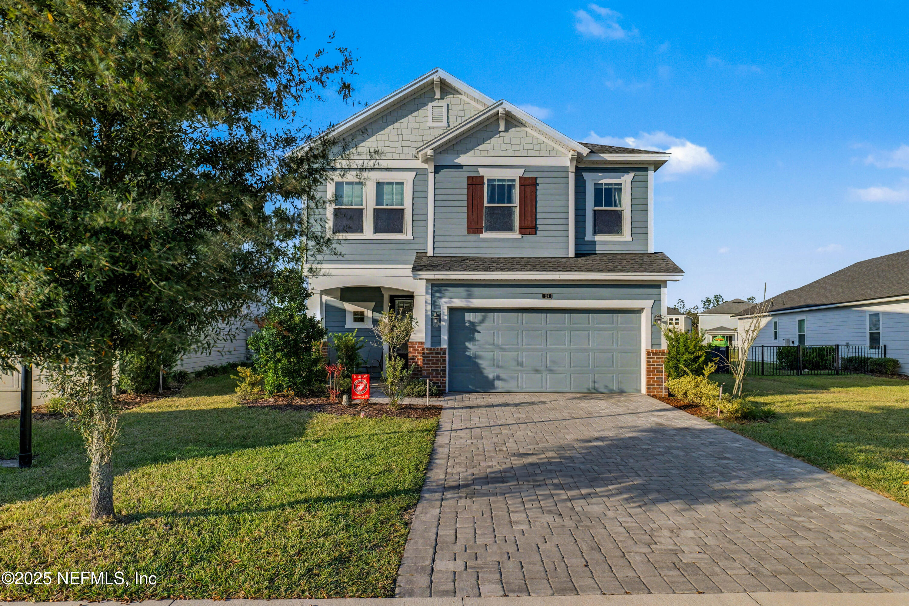 139 Spinner Drive Ponte Vedra, FL 32081 - Photo 2 of 67 a front view of a house with a yard and trees