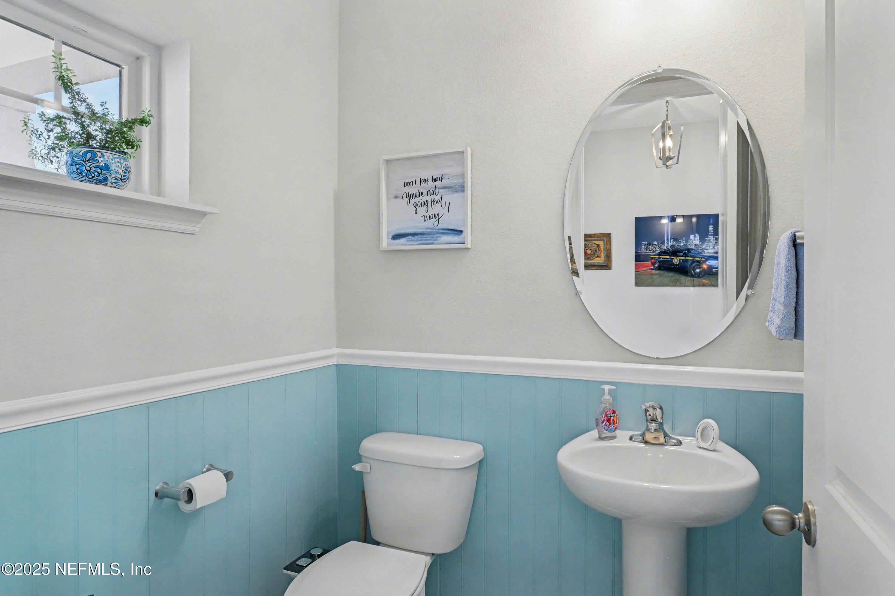 139 Spinner Drive Ponte Vedra, FL 32081 - Photo 21 of 67 a bathroom with a toilet sink and mirror