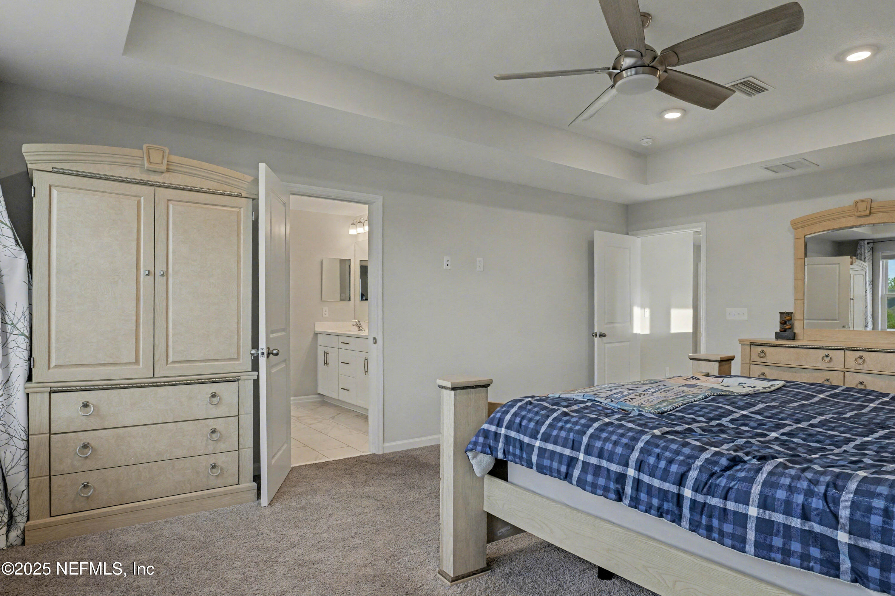 139 Spinner Drive Ponte Vedra, FL 32081 - Photo 24 of 67 a bedroom with a large bed and ceiling fan