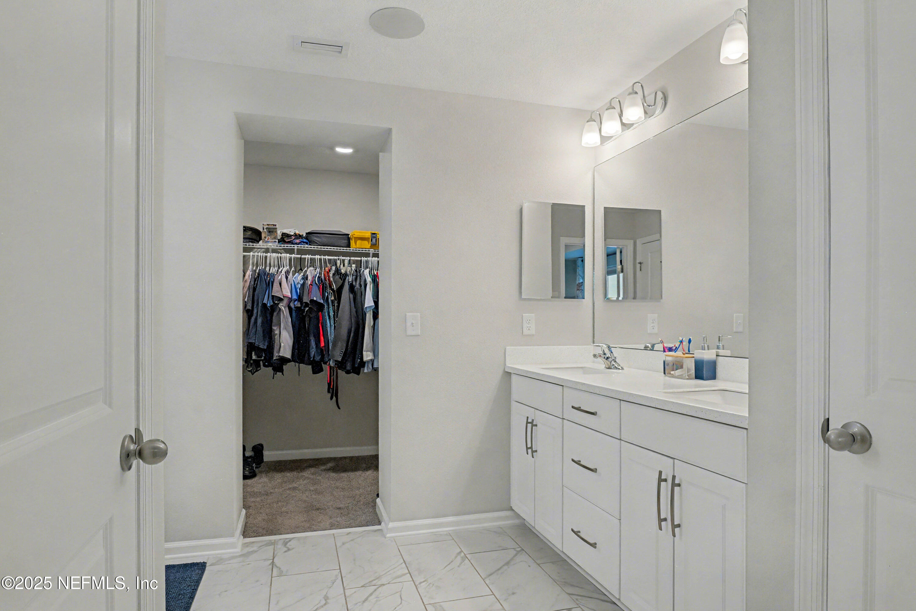 139 Spinner Drive Ponte Vedra, FL 32081 - Photo 25 of 67 a bathroom with a double vanity sink mirror and shower