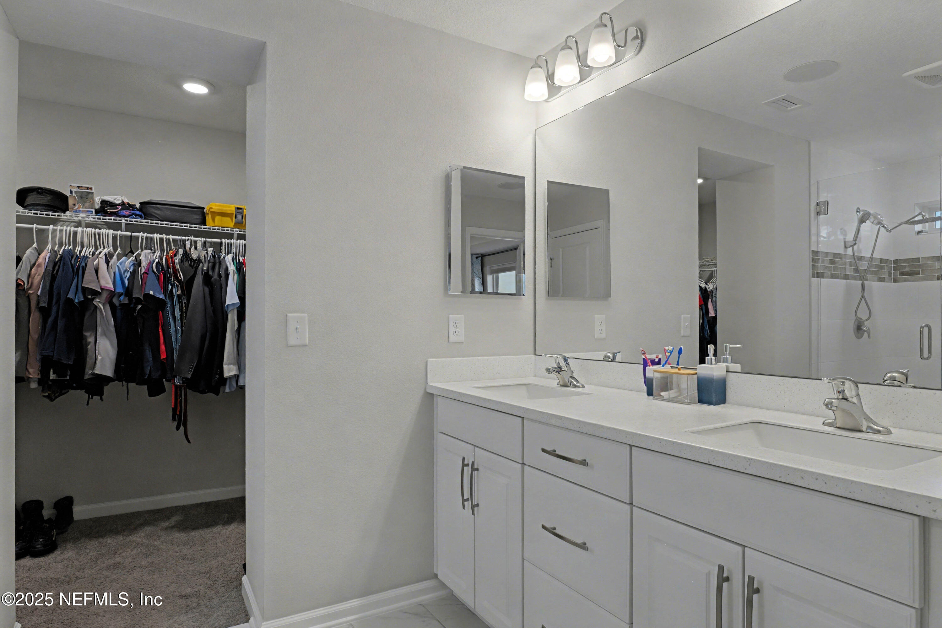 139 Spinner Drive Ponte Vedra, FL 32081 - Photo 26 of 67 a en suite bathroom with a sink and mirror