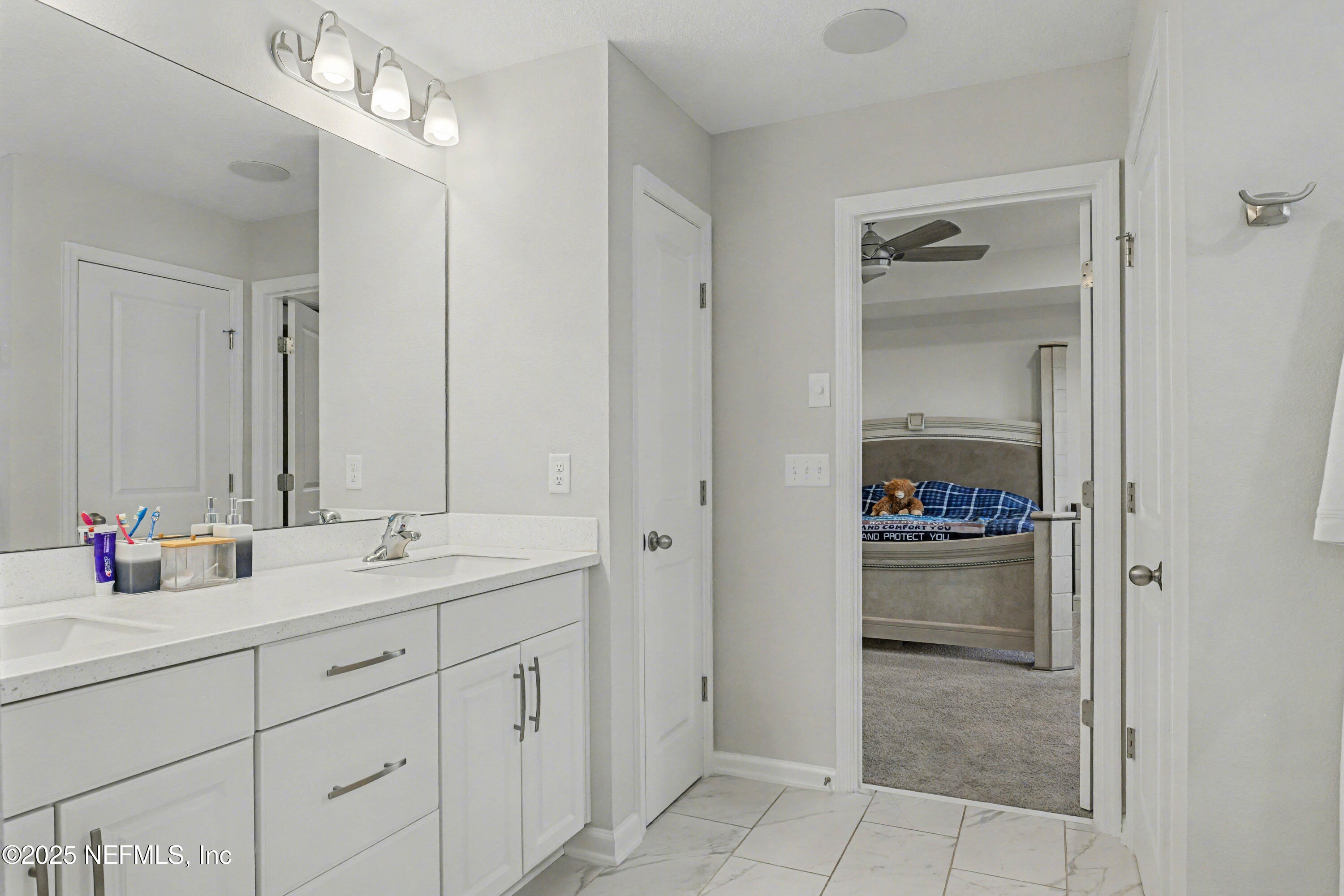 139 Spinner Drive Ponte Vedra, FL 32081 - Photo 28 of 67 a bathroom with a sink and a mirror