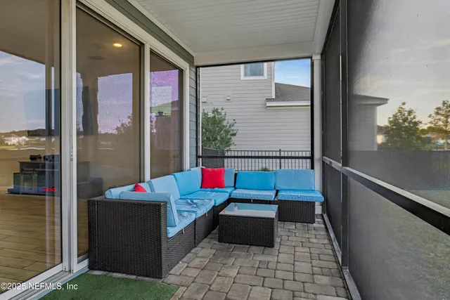 an aerial view of a house with a lake view
