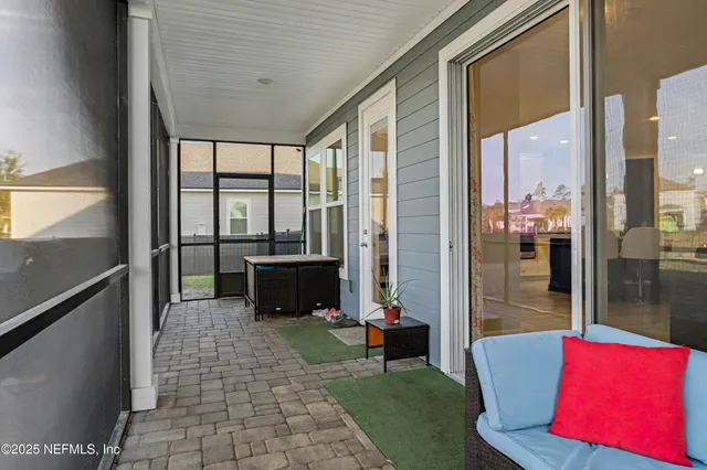 an aerial view of a house with garden space and street view