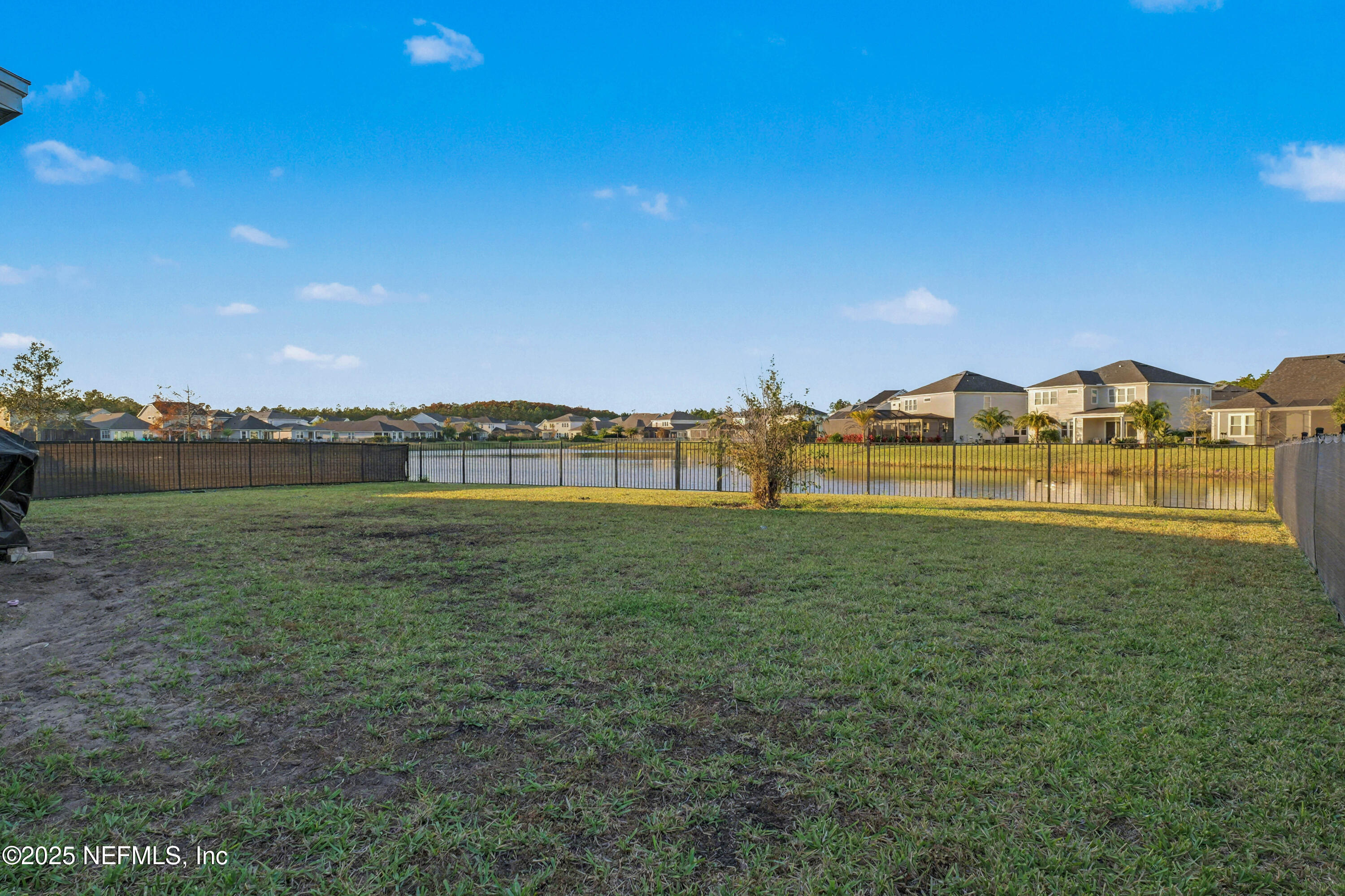 139 Spinner Drive Ponte Vedra, FL 32081 - Photo 43 of 67 a view of a lake with houses in the back