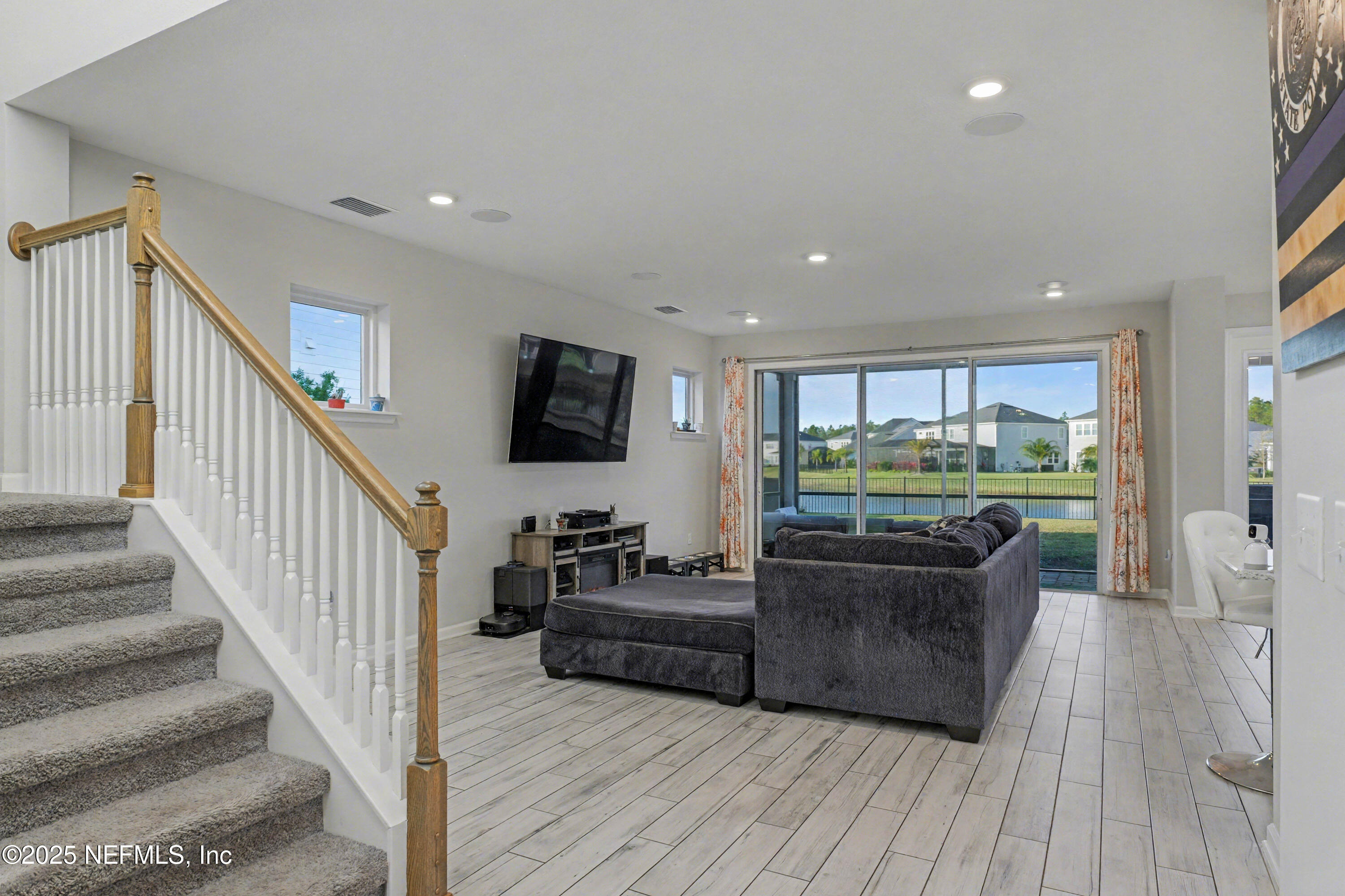 139 Spinner Drive Ponte Vedra, FL 32081 - Photo 10 of 67 a living room with furniture and a flat screen tv