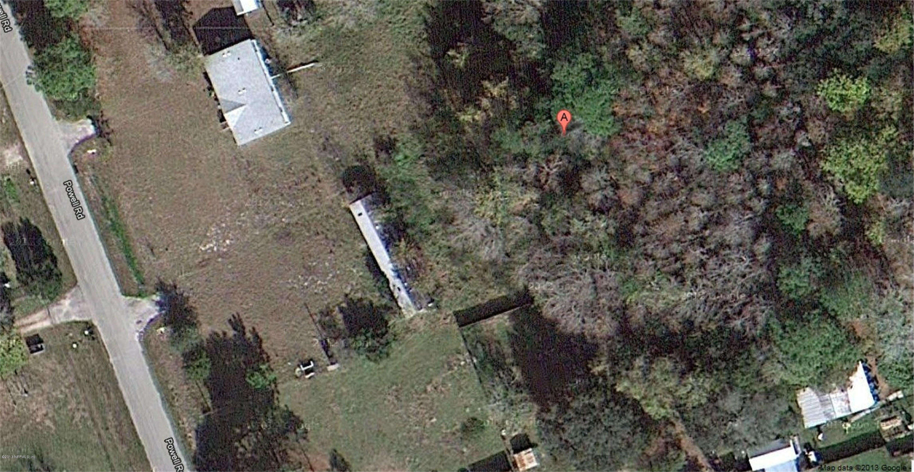 1930 Powell Road St. Augustine, FL 32084 - Photo 1 of 2 an aerial view of a house with a yard