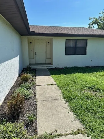 a view of a back yard of the house