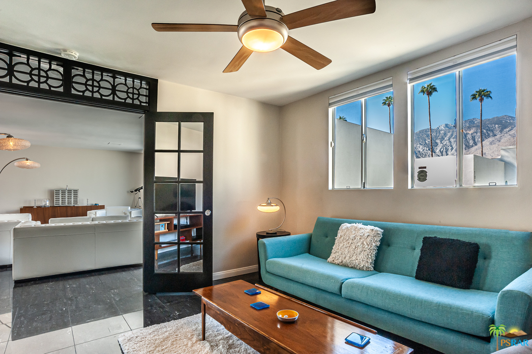 1805 Sandcliff Road Palm Springs, CA 92264 - Photo 11 of 51 a living room with furniture and a flat screen tv