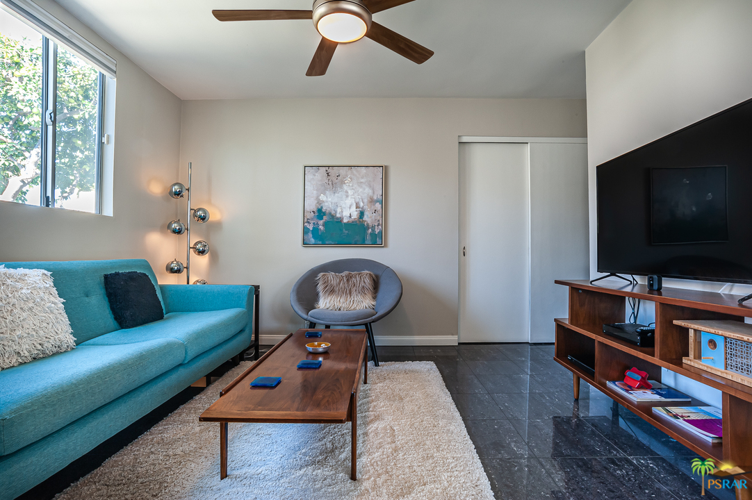 1805 Sandcliff Road Palm Springs, CA 92264 - Photo 15 of 51 a living room with furniture and a flat screen tv