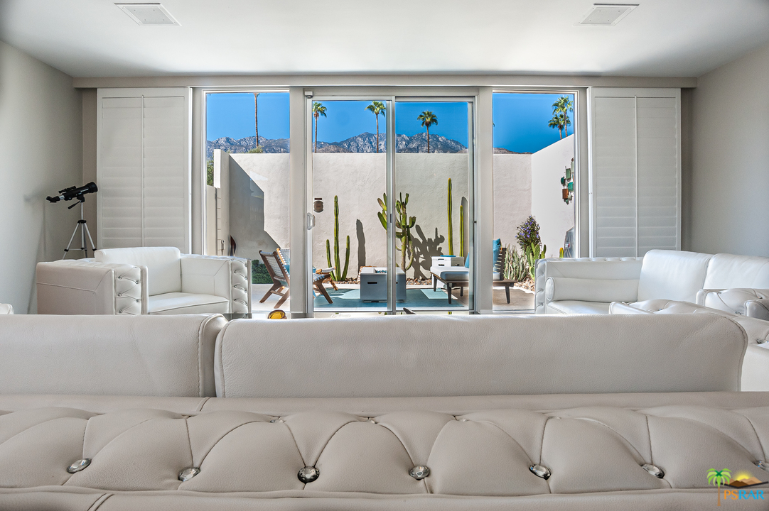 1805 Sandcliff Road Palm Springs, CA 92264 - Photo 6 of 51 a living room with a couch and a table