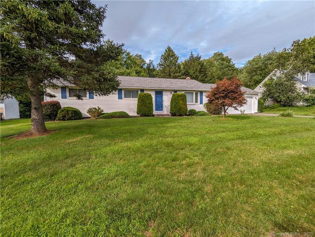 329 Abbe Road Enfield, CT 06082 - Photo 1 of 1 a front view of a house with a garden