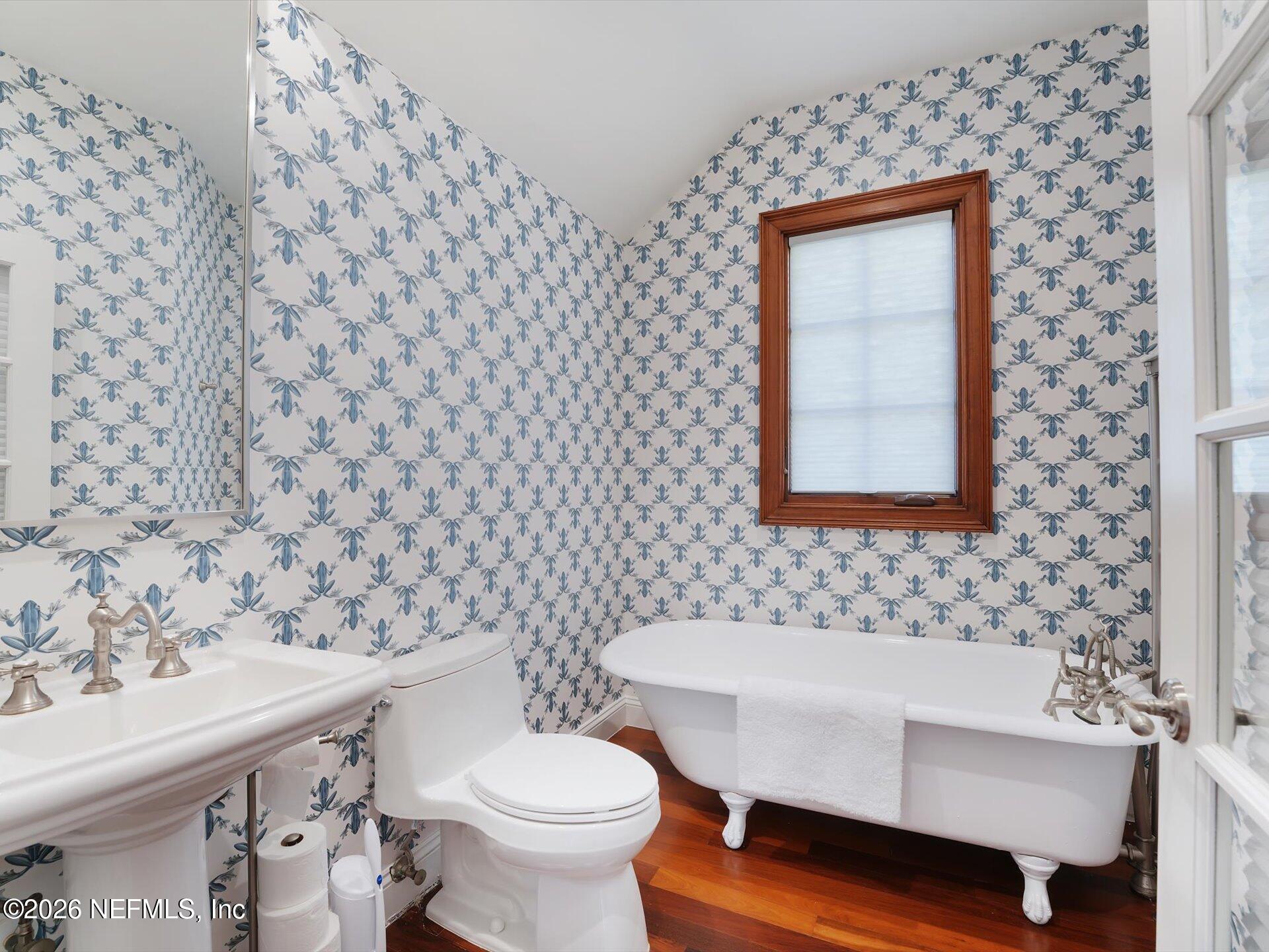 322 6th Street Atlantic Beach, FL 32233 - Photo 15 of 45 a bathroom with a toilet and a sink