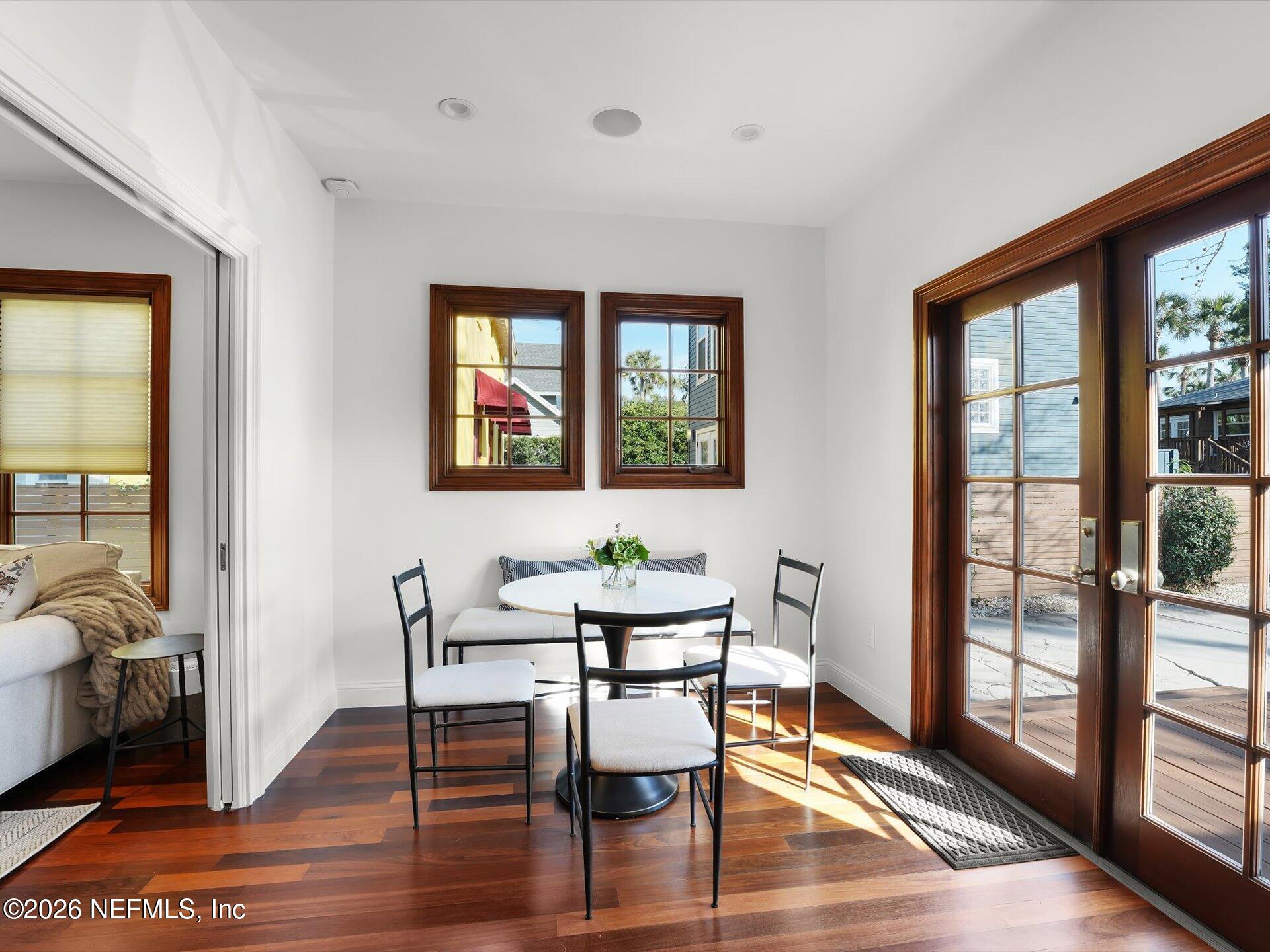 322 6th Street Atlantic Beach, FL 32233 - Photo 19 of 45 a dining room with furniture wooden floor and a rug