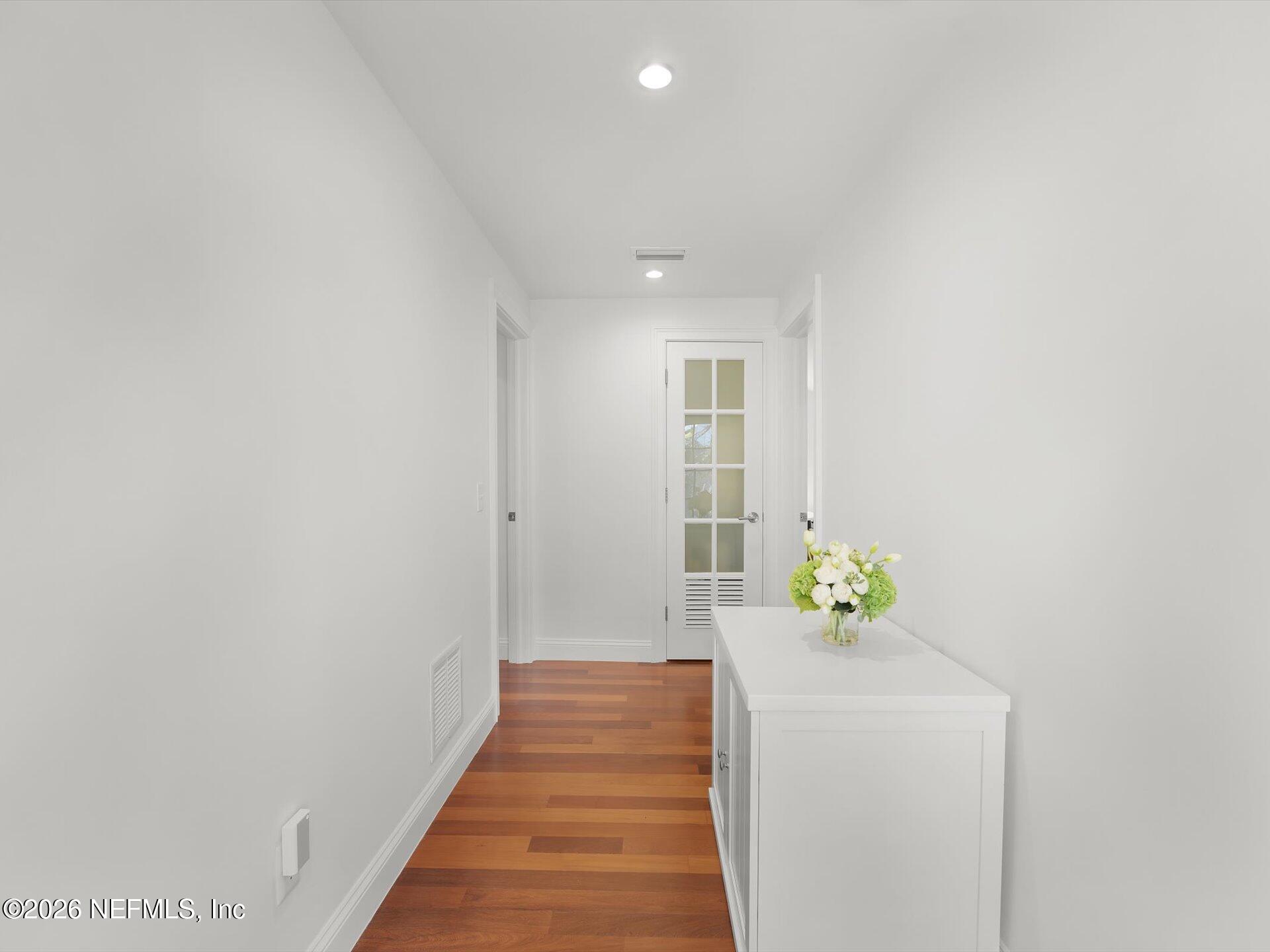 322 6th Street Atlantic Beach, FL 32233 - Photo 22 of 45 a hallway with painting and flowers