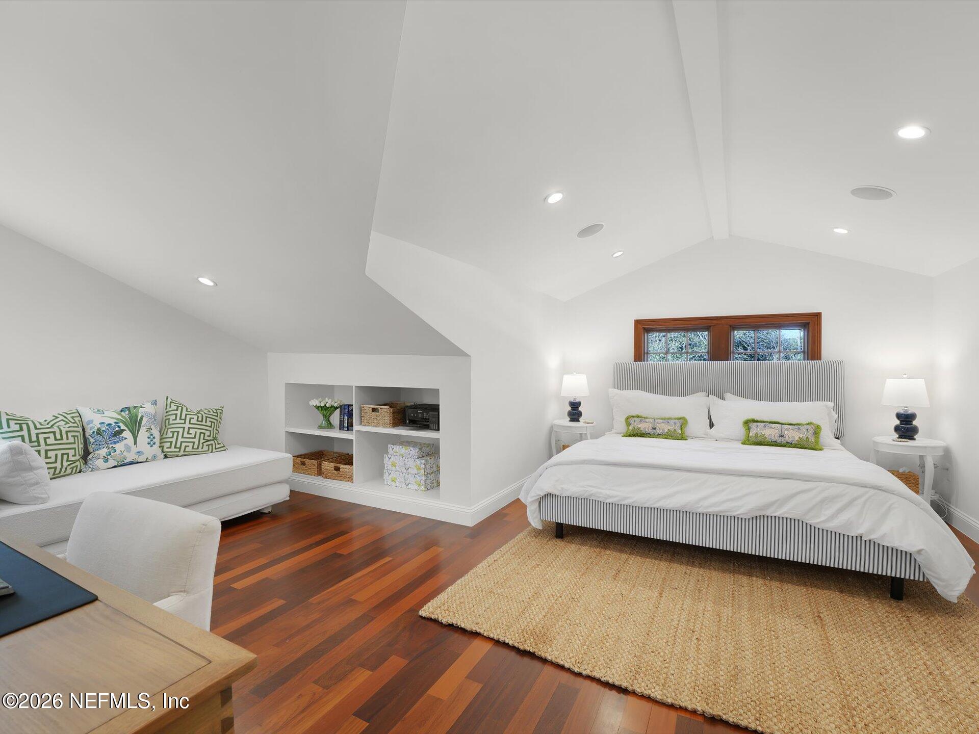 322 6th Street Atlantic Beach, FL 32233 - Photo 23 of 45 a bedroom with a bed and wooden floor