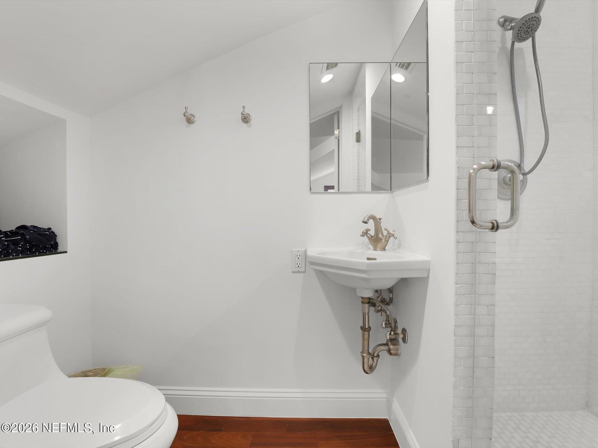 322 6th Street Atlantic Beach, FL 32233 - Photo 26 of 45 a bathroom with a sink toilet and shower