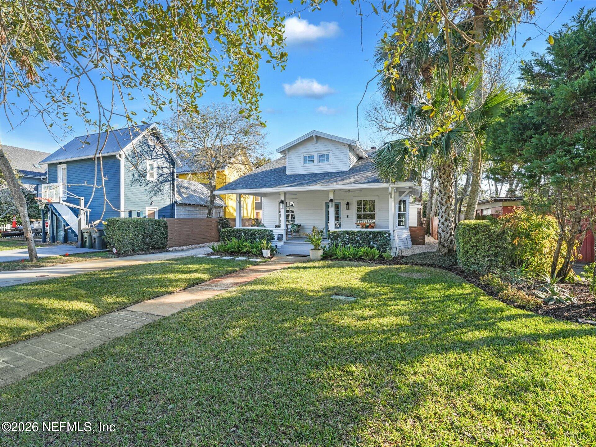 322 6th Street Atlantic Beach, FL 32233 - Photo 3 of 45 a front view of a house with swimming pool having outdoor seating