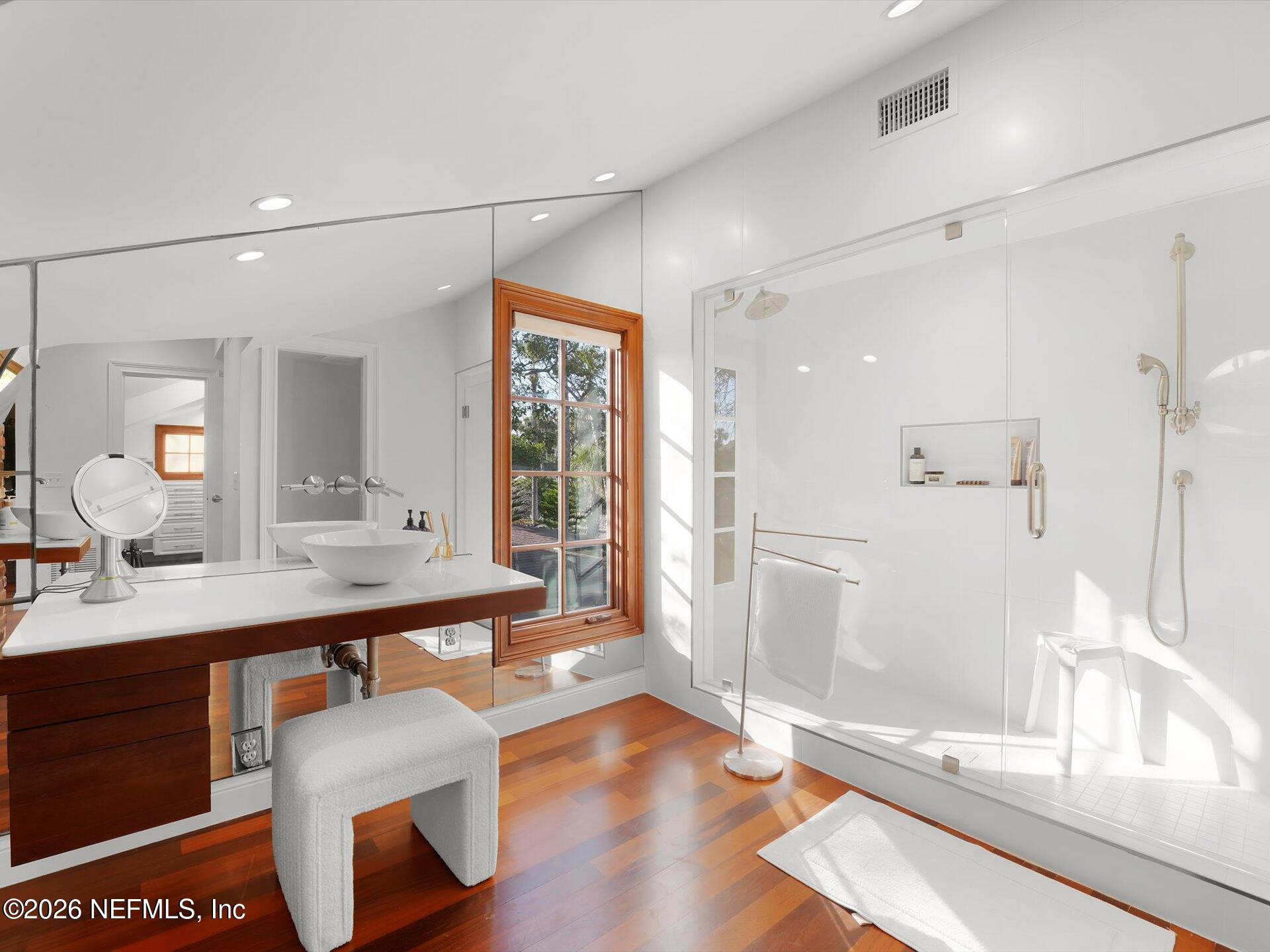 322 6th Street Atlantic Beach, FL 32233 - Photo 32 of 45 a bathroom with a sink a toilet a mirror and shower
